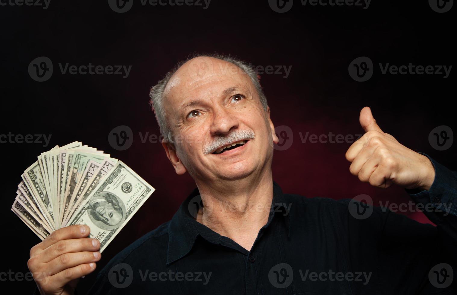 old man with dollar bills photo