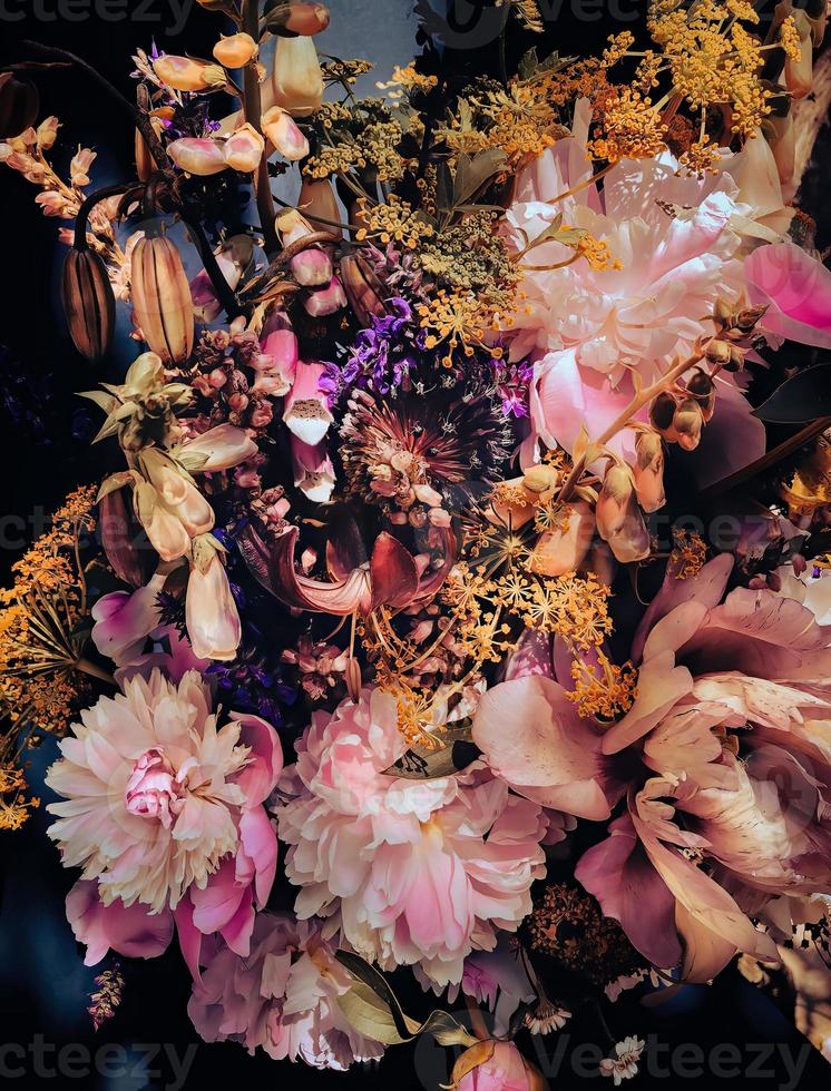 Romantic bouquets of spring flowers with peonies, sage, foxglove, geyhera photo