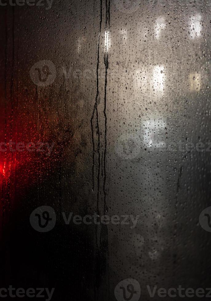 Blackout in Kyiv. Glass showcases with raindrops and sleet photo