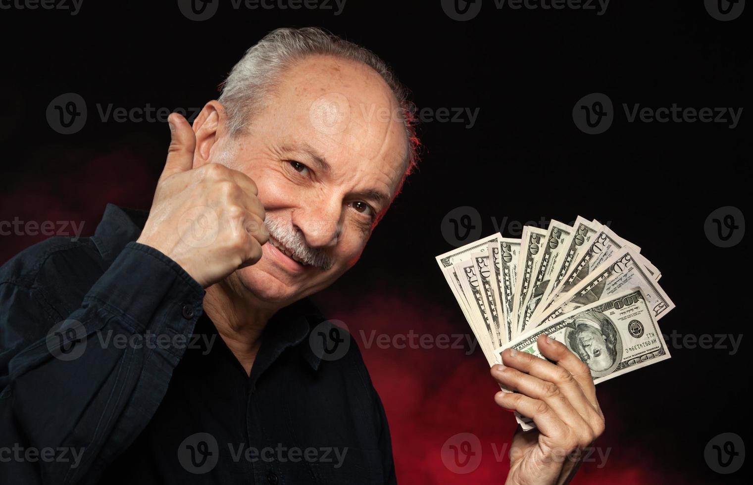 old man with dollar bills photo