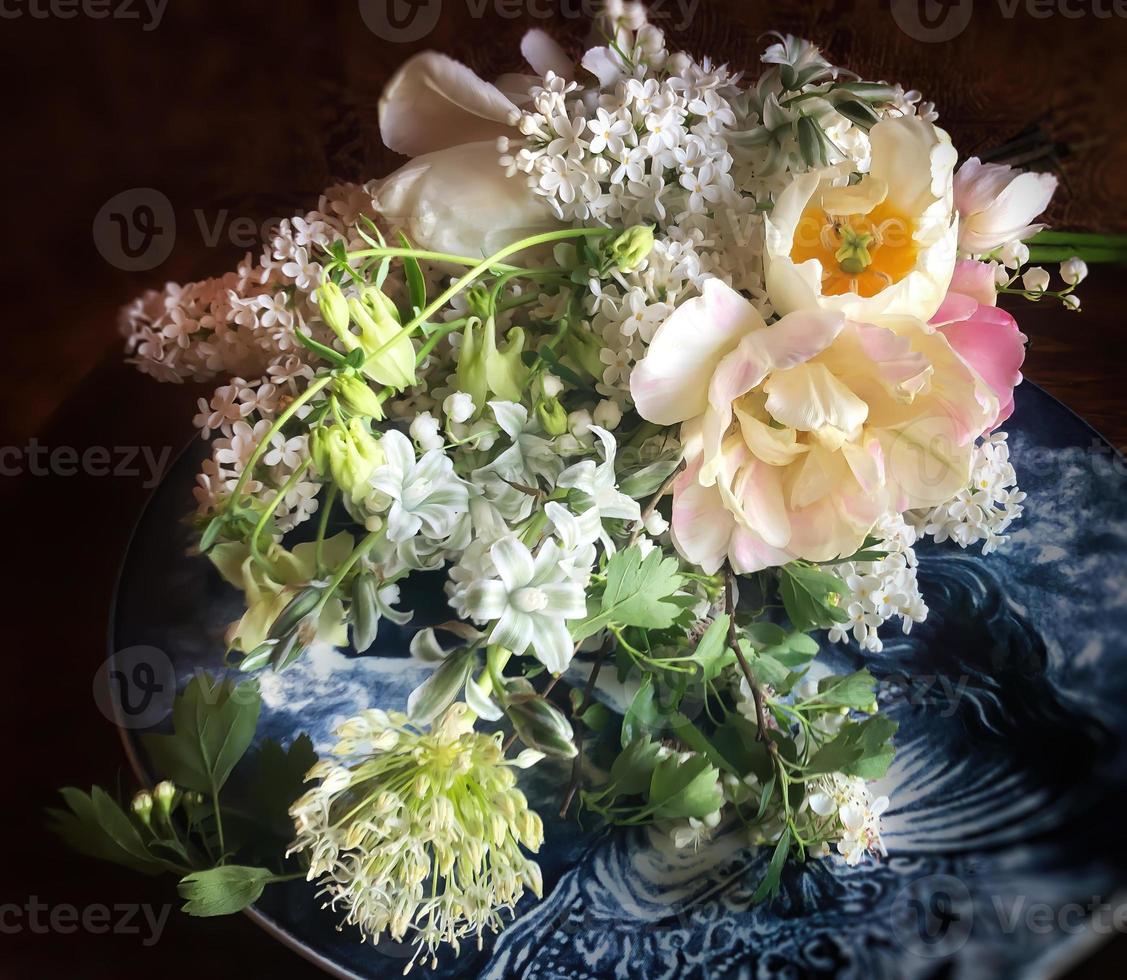 Romantic bouquet on a decorative plate photo