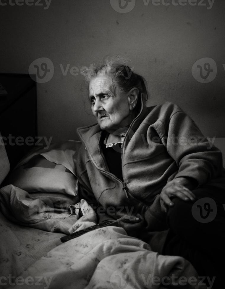 very old and tired of life wrinkled woman photo