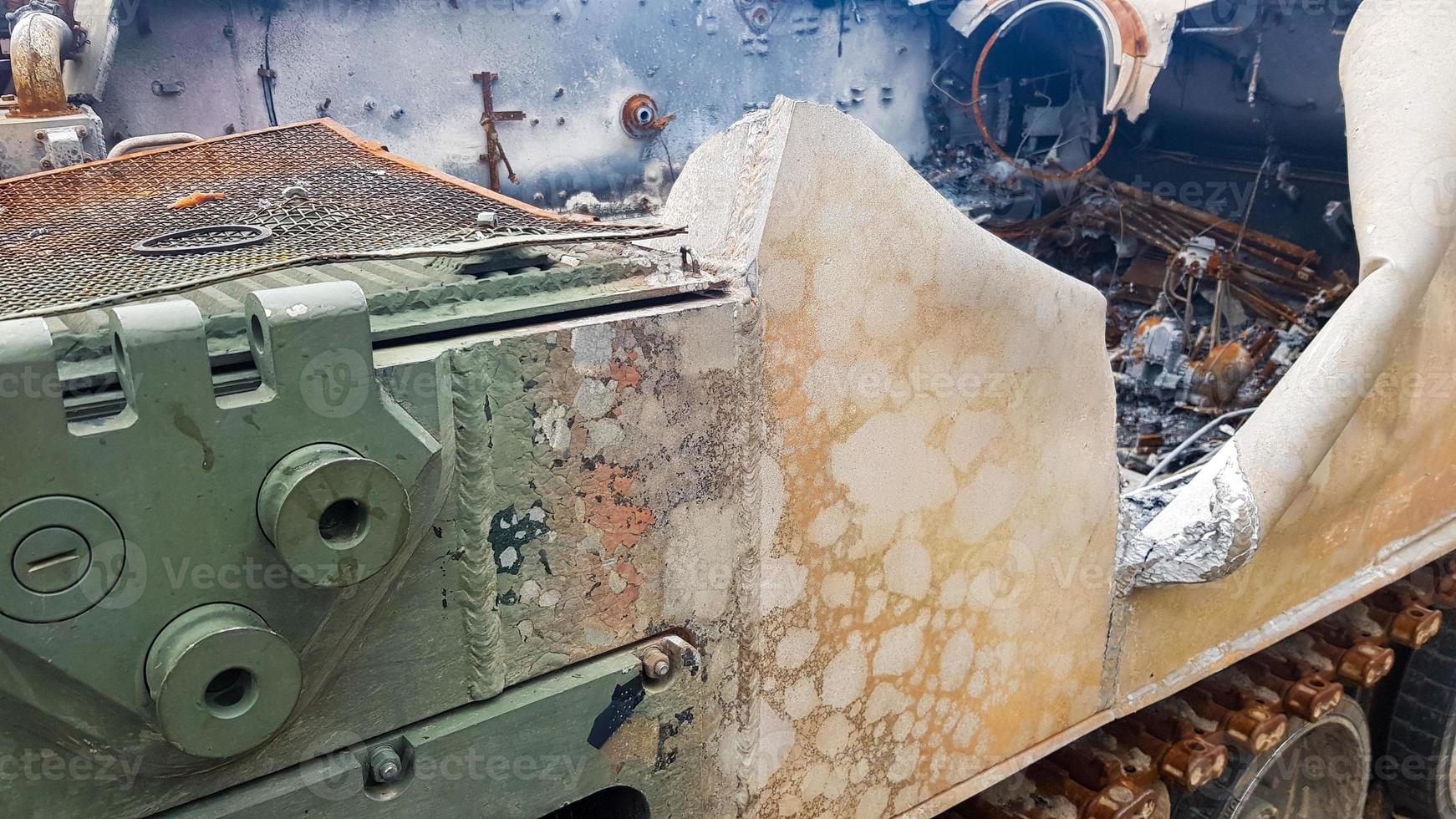 Destroyed Russian military equipment, destroyed armored car. War in Ukraine. Fragment of a rusty burnt car. Salon armored car armored personnel carrier. Remains of military equipment. photo
