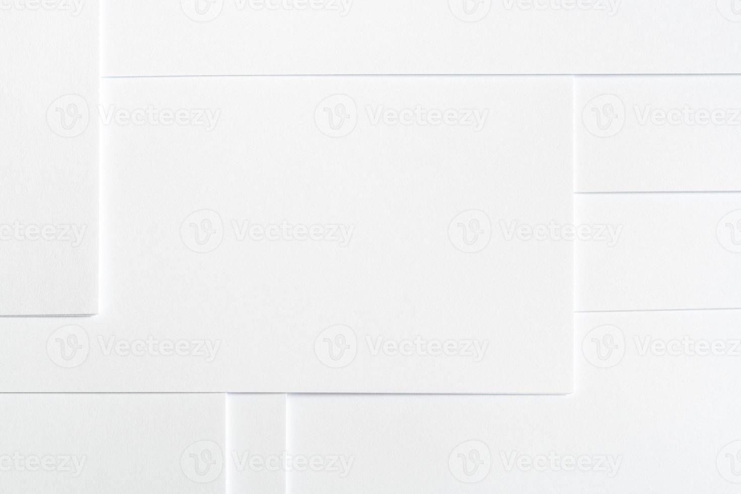 Abstract white minimalist background of clean paper sheets neatly laid out in geometric pattern. photo