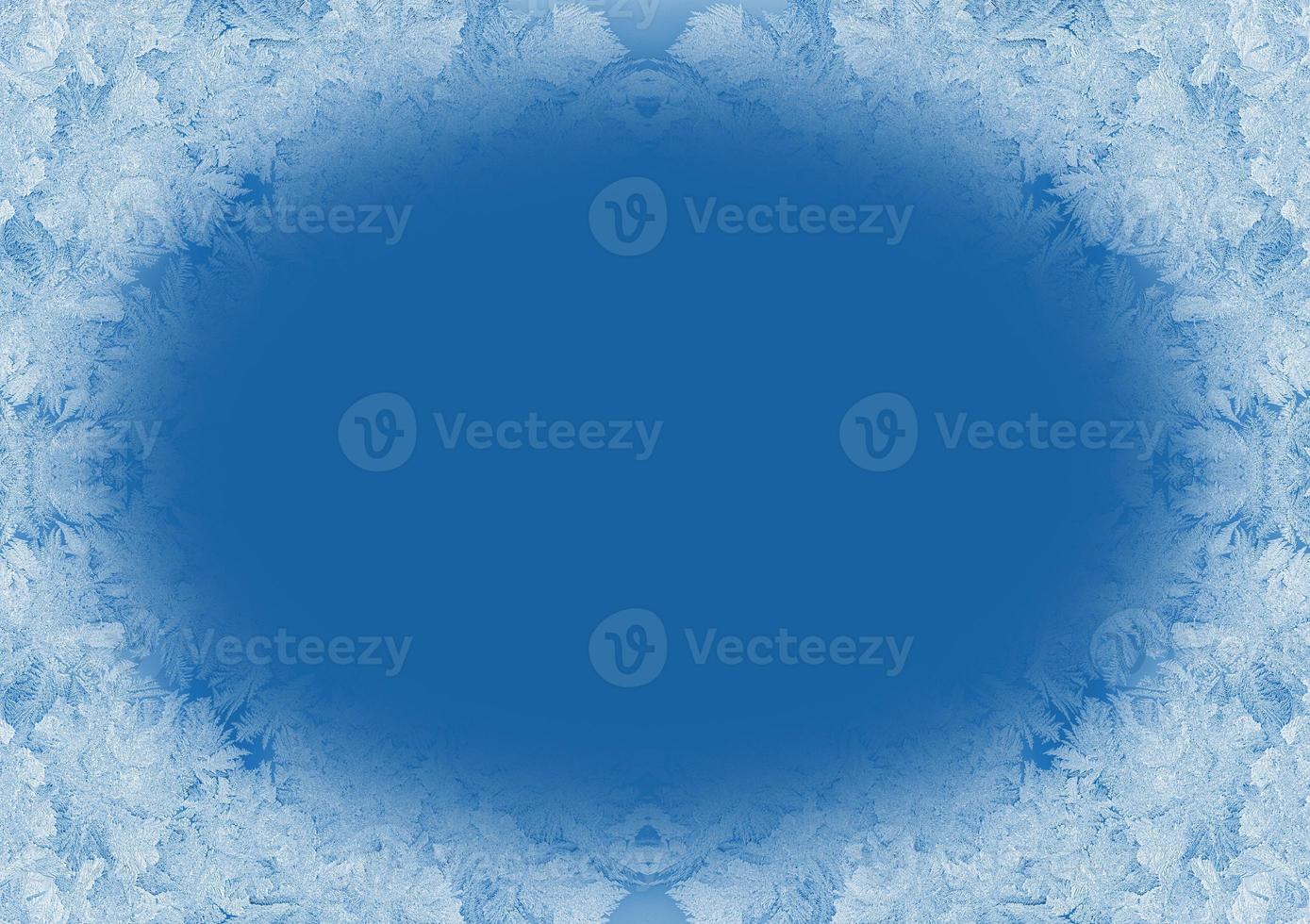 Christmas background in trendy color 2020 Classic Blue. Winter frosty window pane with copy space. photo