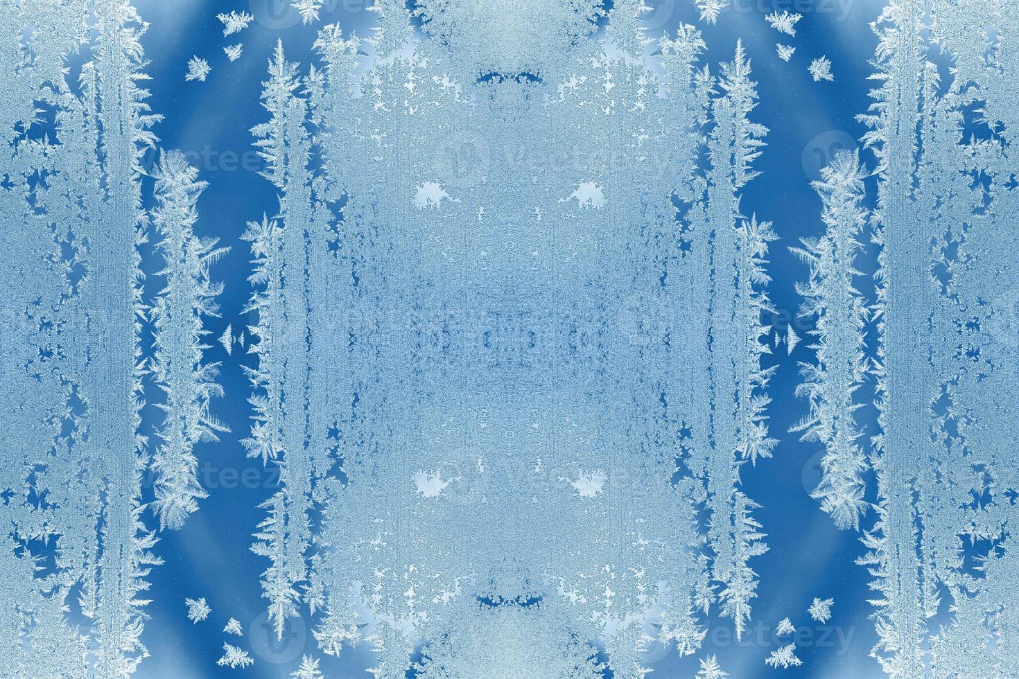 Pattern of few repeated frosty patterns in trendy 2020 Classic Blue as Christmas festive natural background. photo