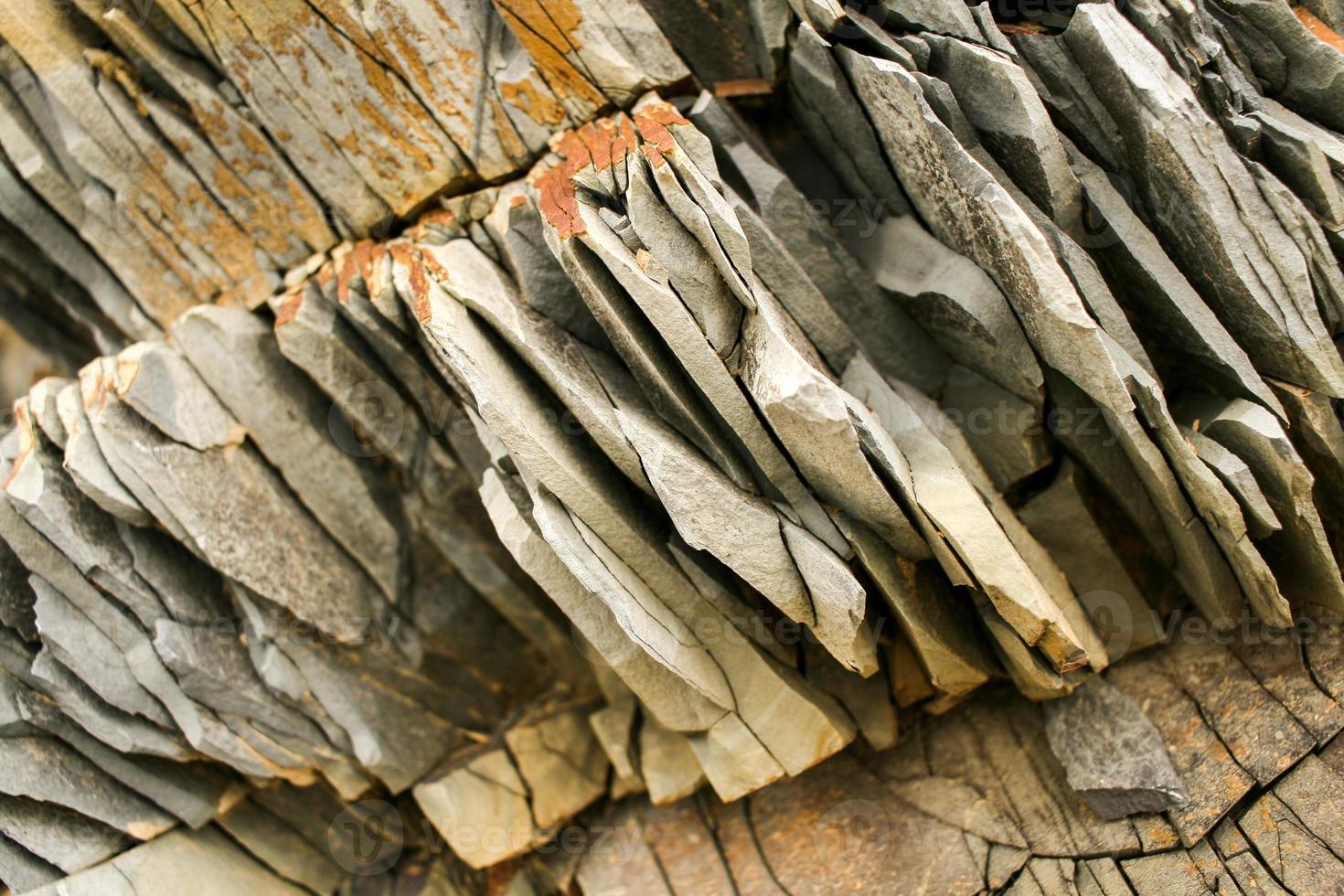 Diagonal large piece of natural layered grey mountain slate. photo