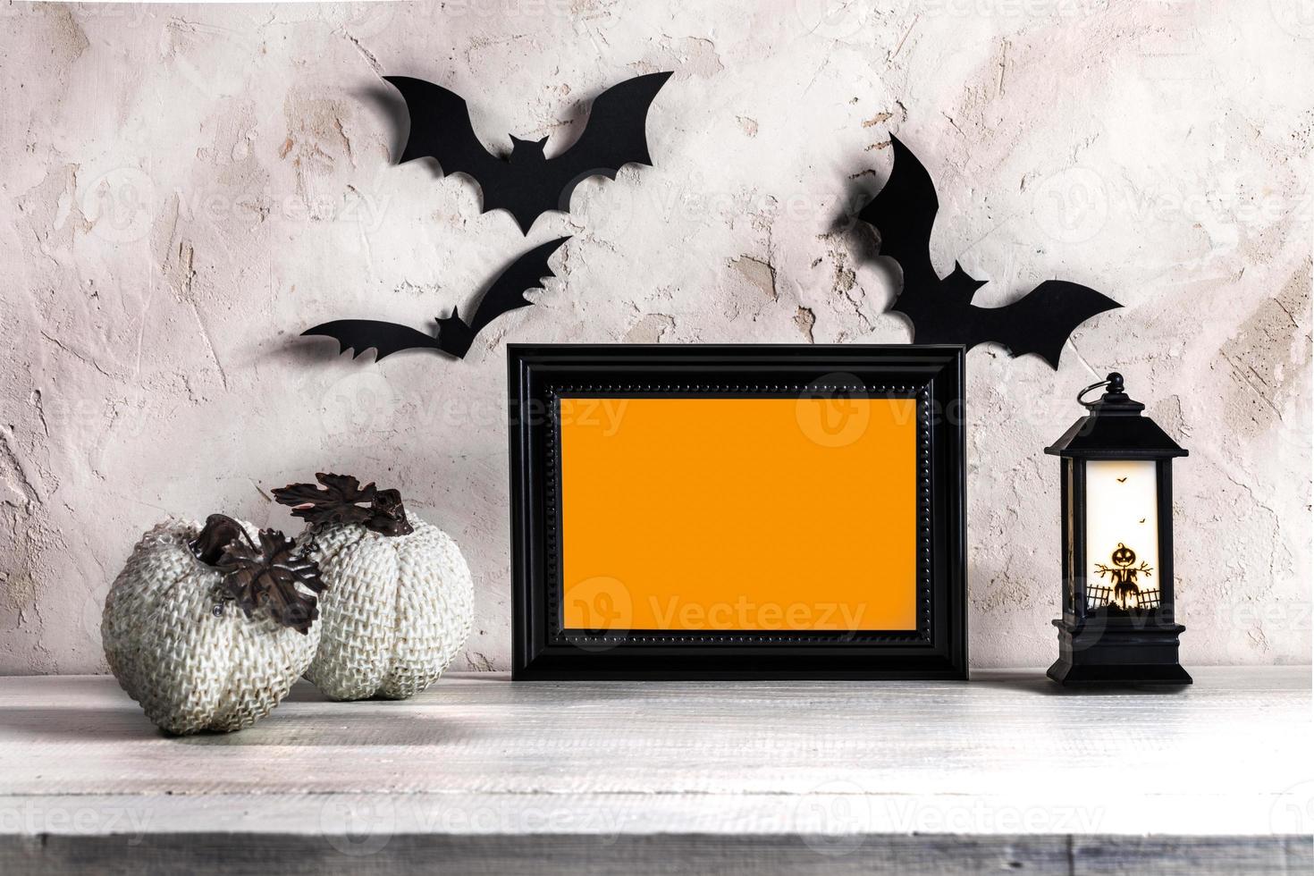Hallowen decorations black frame with orange space for text, decorative pumpkins, bats, lantern. photo