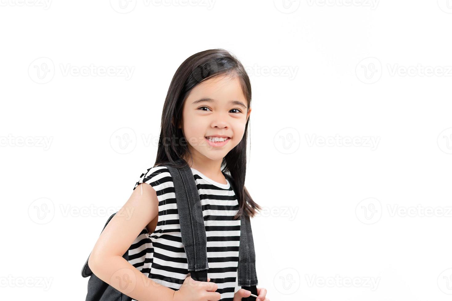 little child girl carry backpack photo