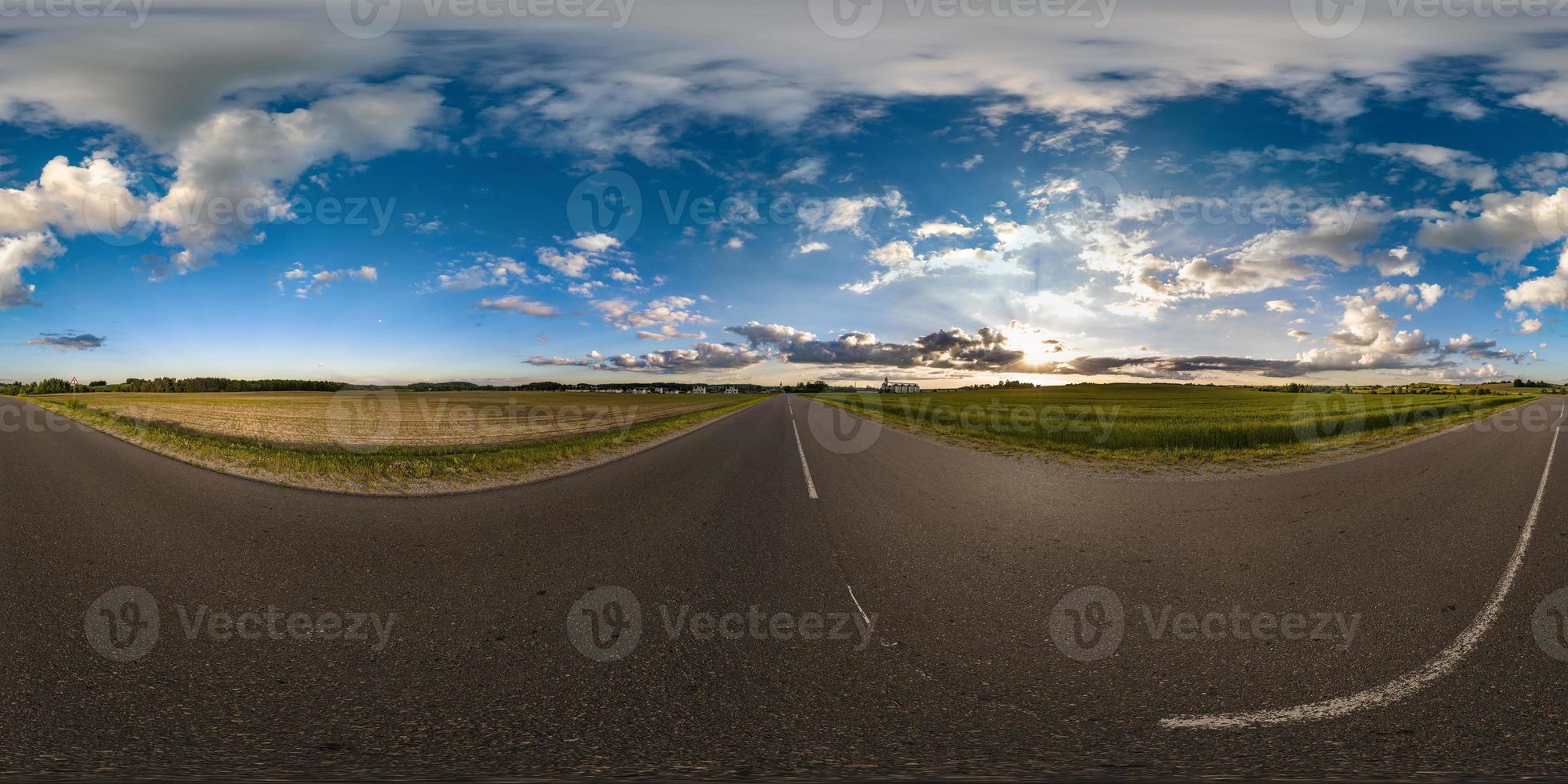 full seamless spherical hdri 360 panorama view on no traffic asphault road among fields with evening sky and clouds in equirectangular projection,can be used as replacement for sky in panoramas photo