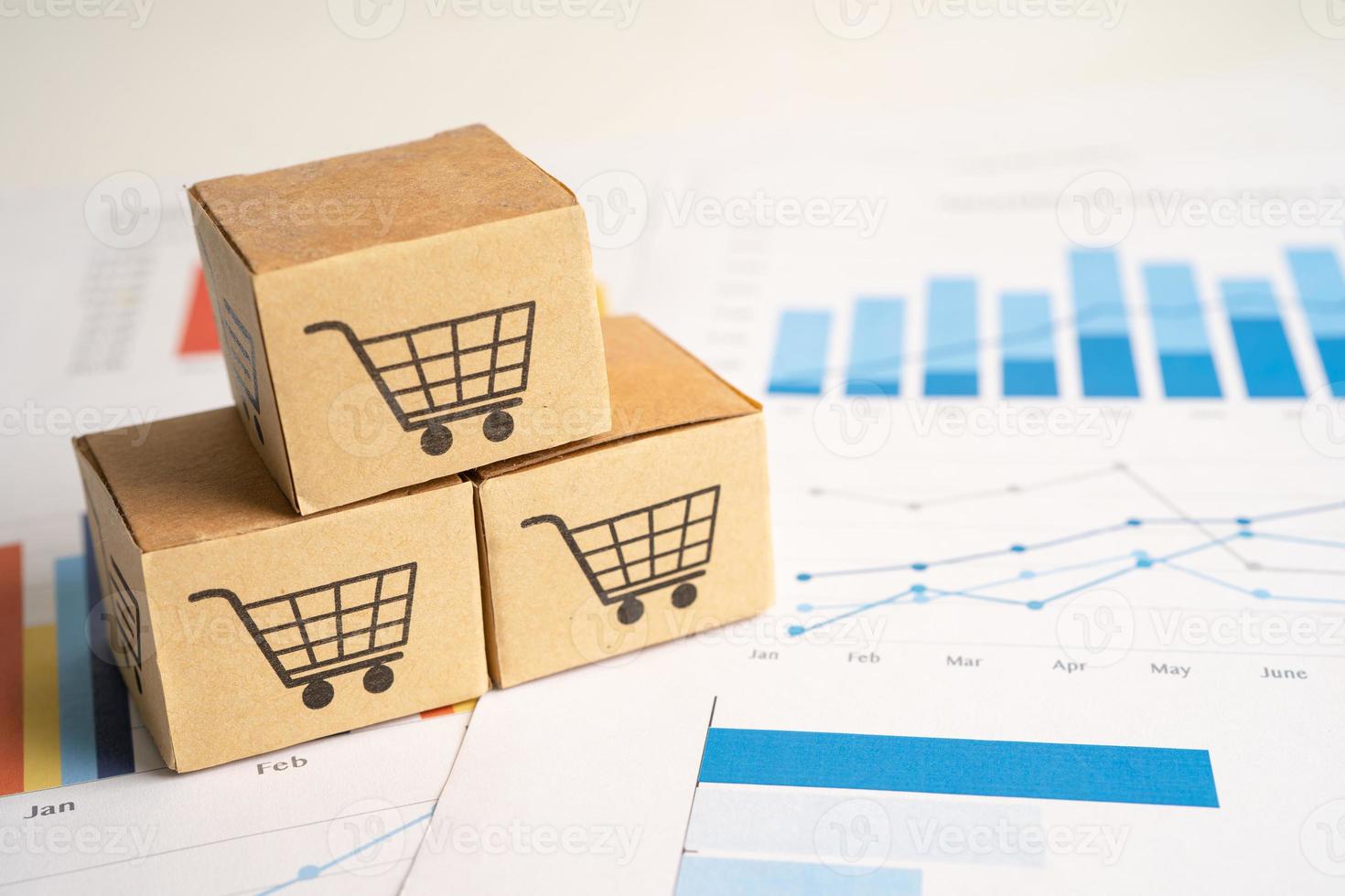 Shopping cart logo on box on graph background. Banking Account, Investment Analytic research data economy, trading, Business import export transportation online company concept. photo