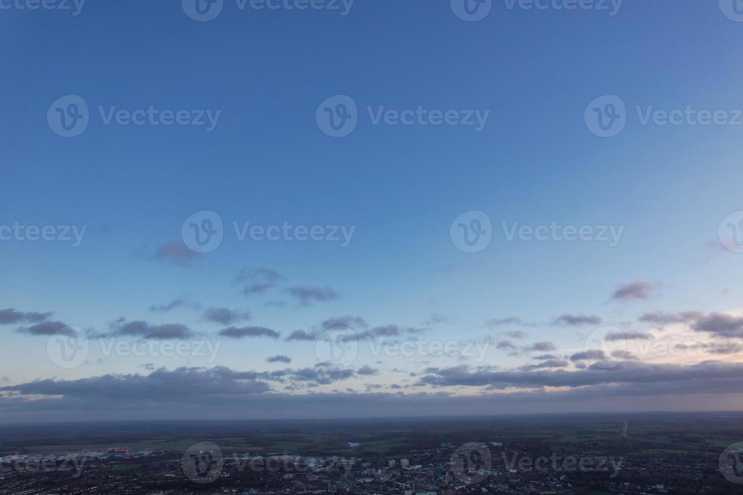 Beautiful Clouds During Sunset over City photo