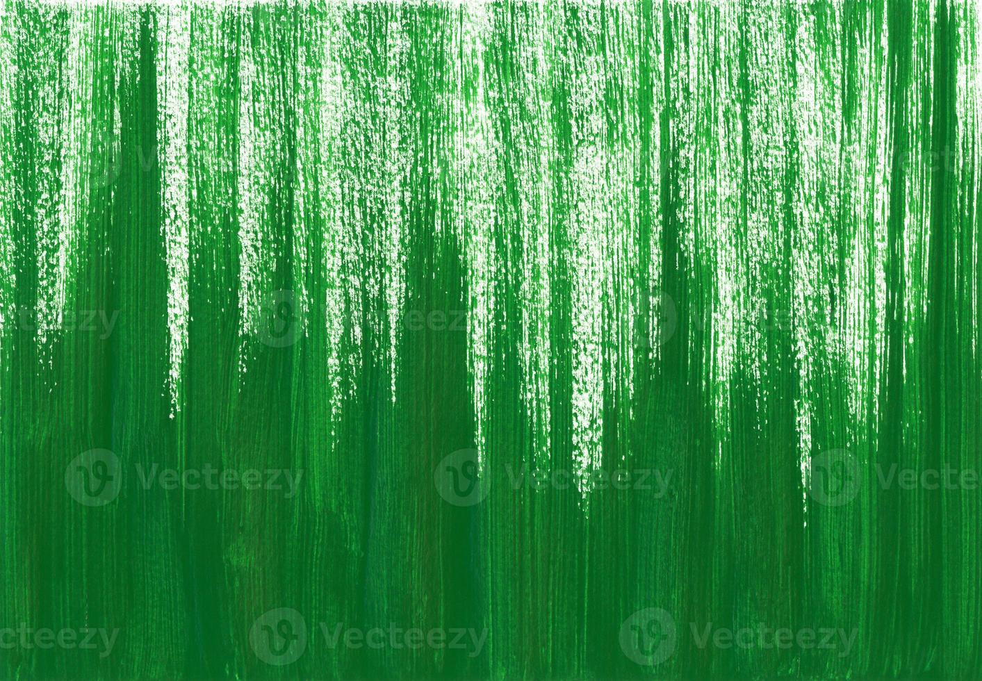 Abstract acrylic or gouache green paint texture on horizontal canvas. Brushstrokes of green paint from bottom to top. Artistic background with place for text. photo
