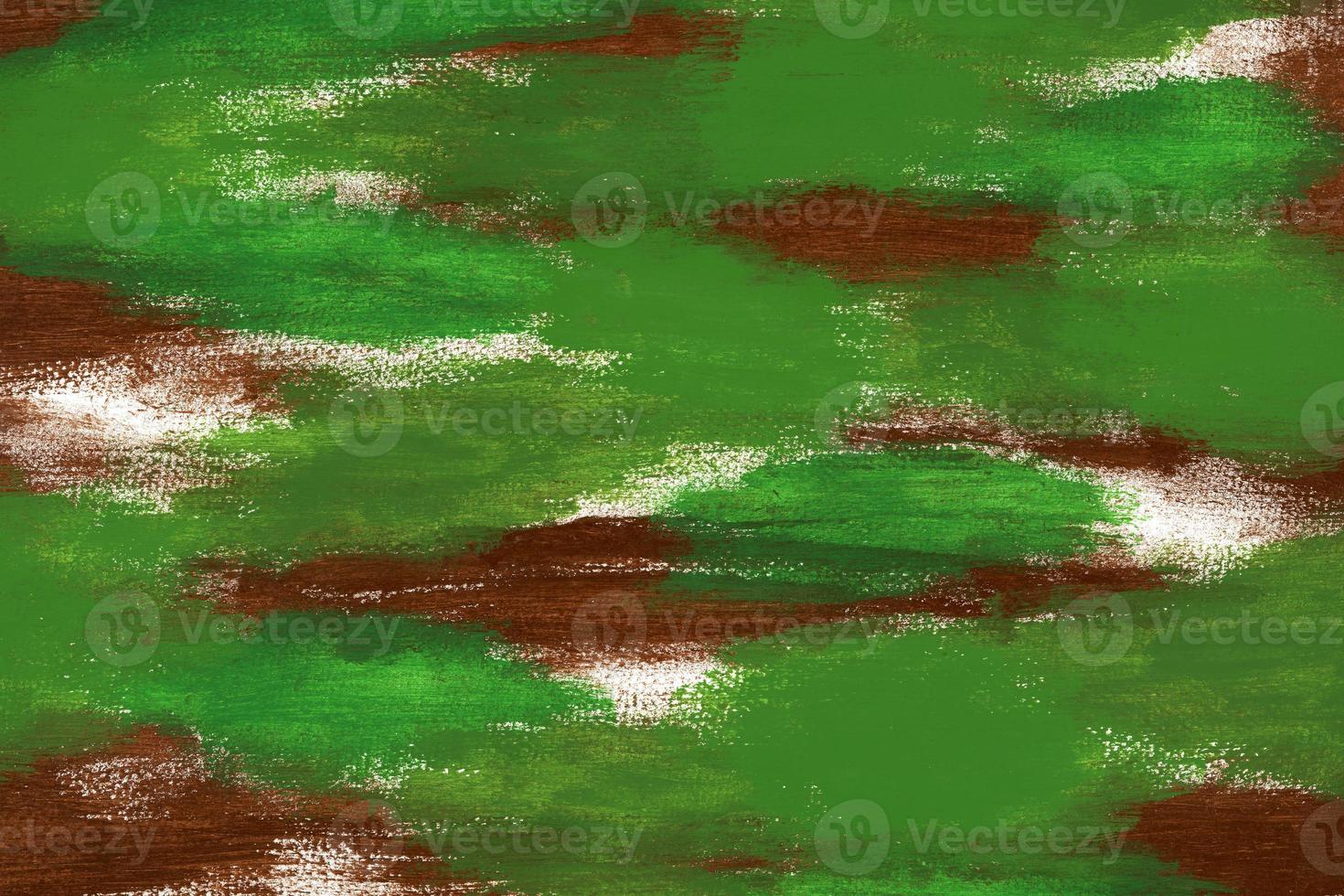 Abstract acrylic brown and green paint on textured horizontal canvas. Brushstrokes of dark brown and shades of green paint create a camouflage pattern. Artistic background with copy space. photo