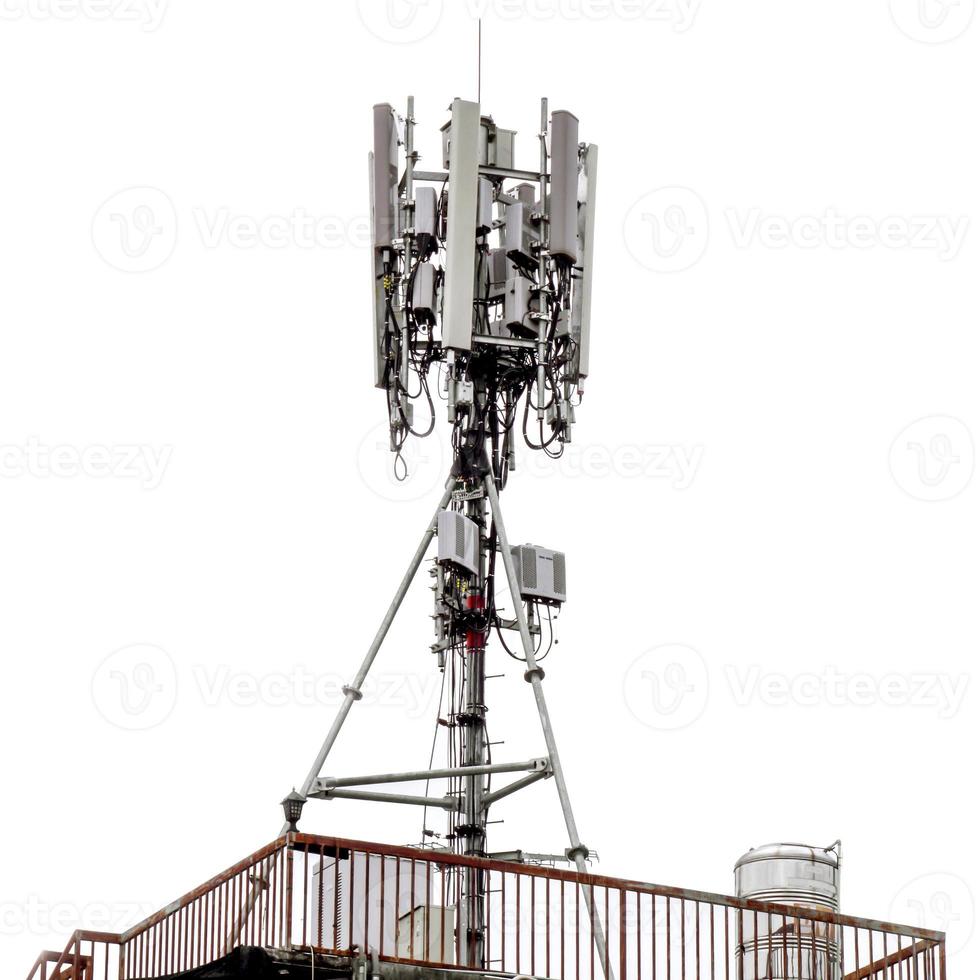 communication tower with antennas on the top of building isolate on white background photo