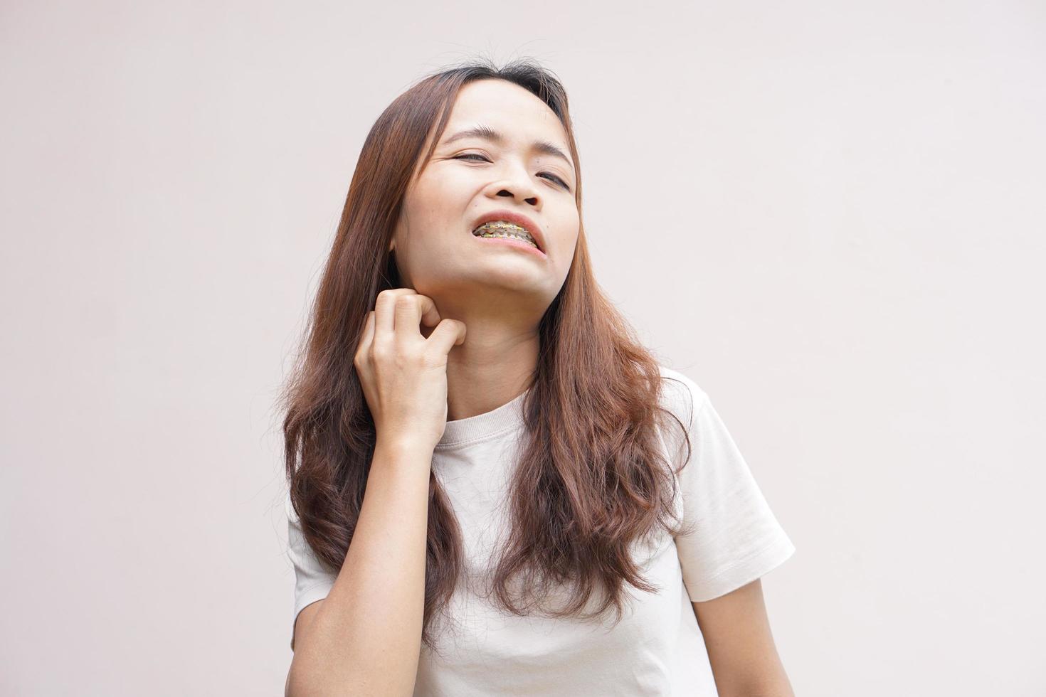 Asian woman having throat itching photo