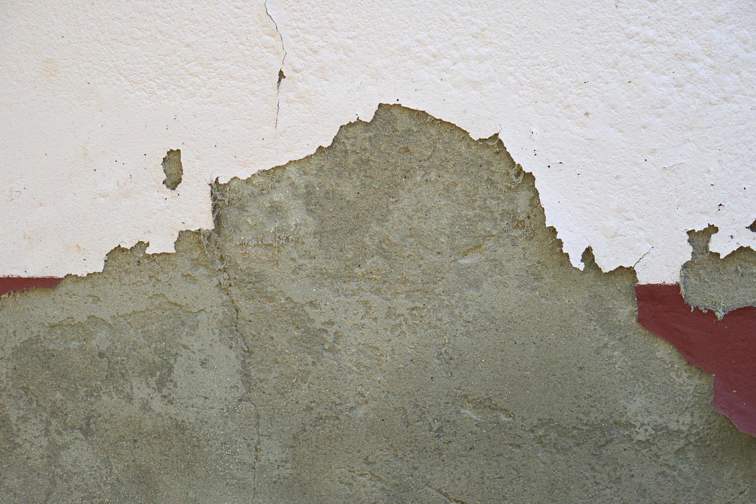 fondo de pared de cemento con pintura desconchada foto