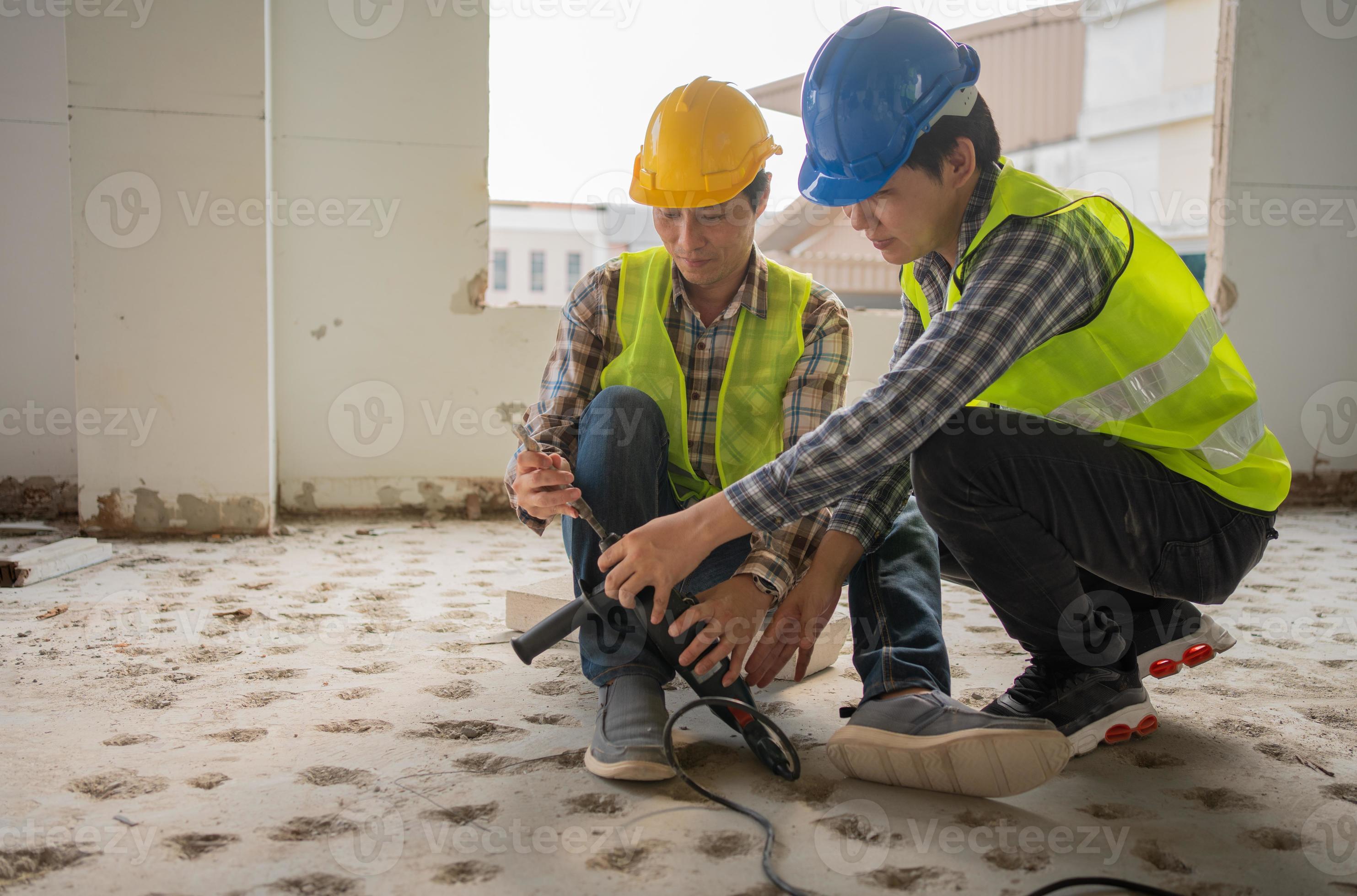 Engineer teaching worker for use electric jackhammer for perforator
