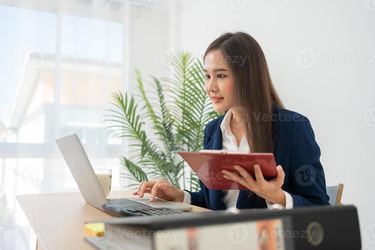 Happy young Asian women startup entrepreneur happy and excited smiling after getting email for success sign business contact, happy girl on the workplace. Distance learning online education and work. photo