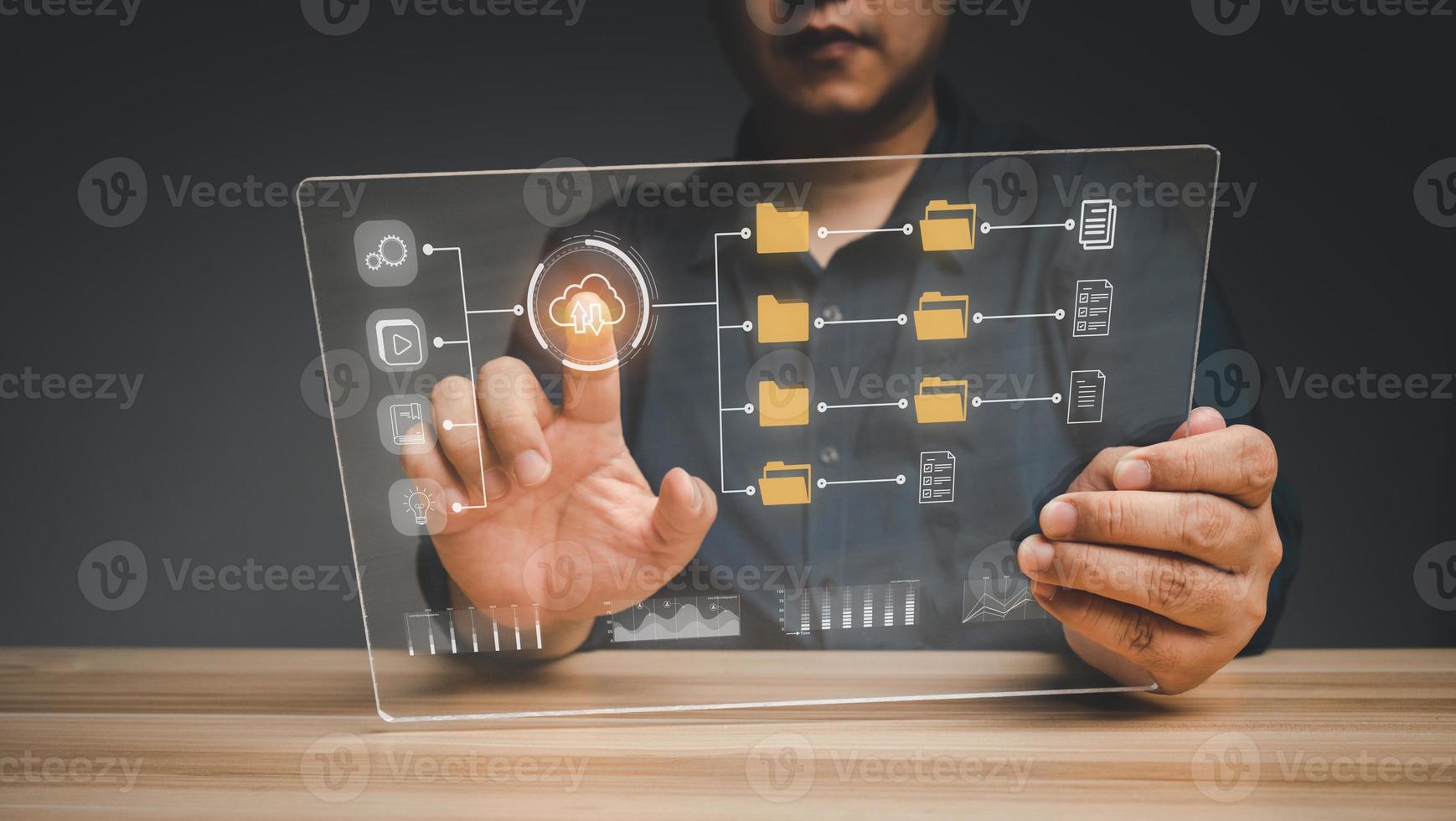 Businessman working on virtual screen of Document Management System DMS. Software for archiving, searching, and managing corporate files and information, documentation in enterprise with ERP. photo