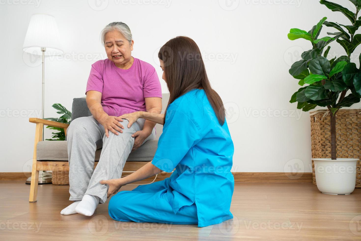 physiotherapist doctor or caregiver helping senior older woman stretching his hamstring and doing thigh or leg rehabilitation in exercise room, Osteoarthritis of the Knee and caregiver concept photo