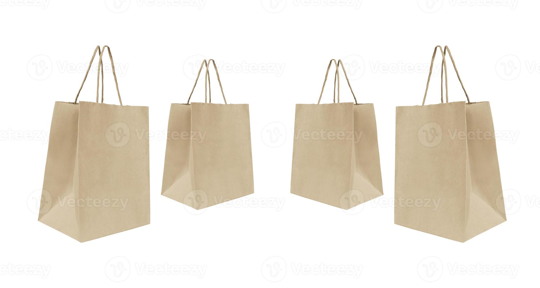 folded paper bag with handles isolated on white background photo