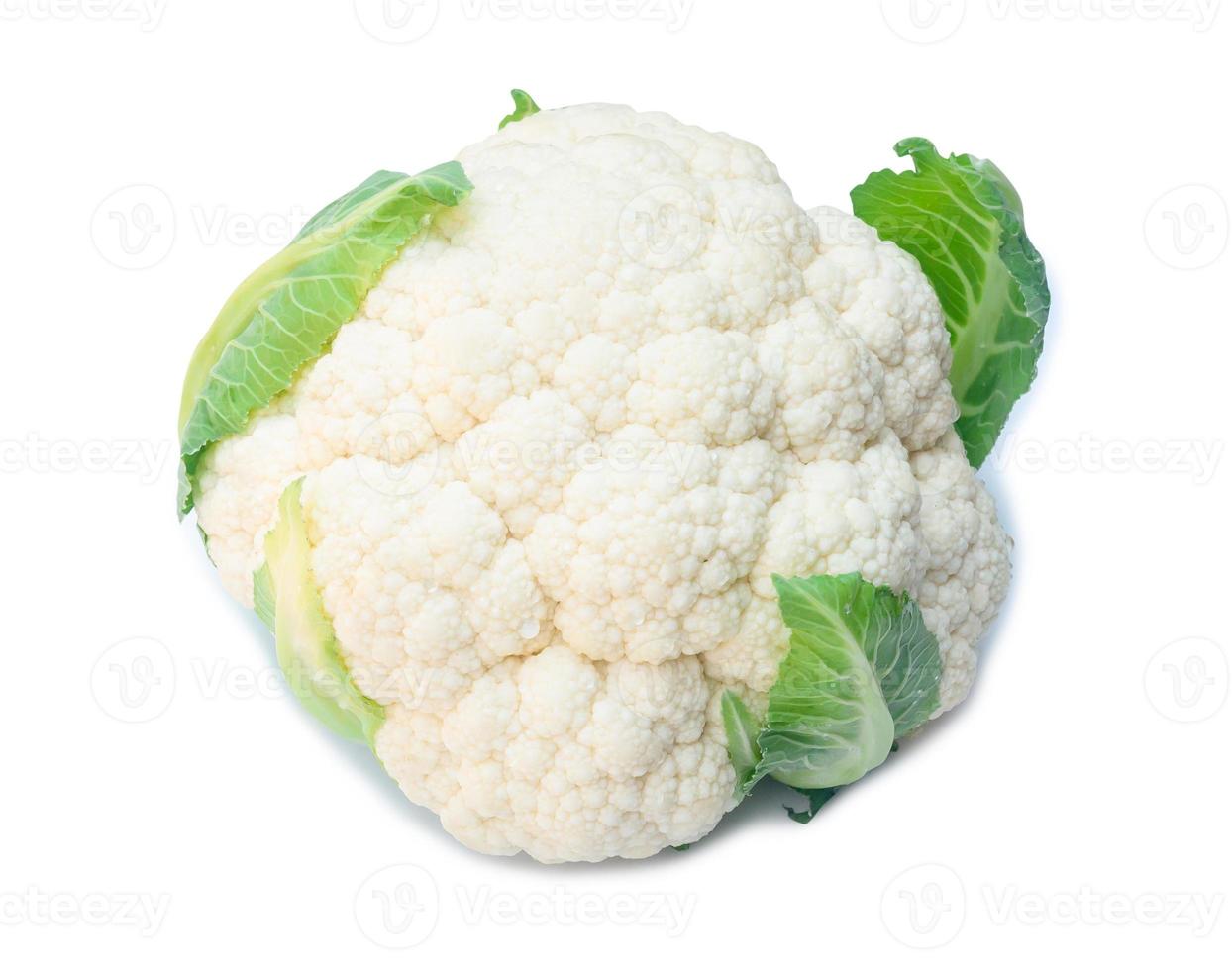 Single fresh ripe white cauliflower head with some green leaves isolated on white background with clipping path, Organic vegetable, Concept of healthy food eating photo