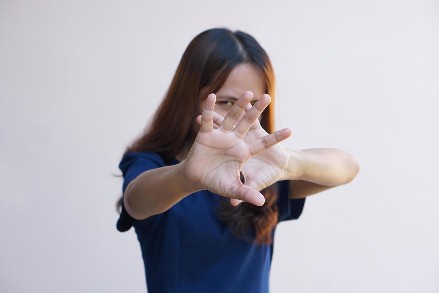 Woman raised her hand for dissuade, campaign stop violence against women photo