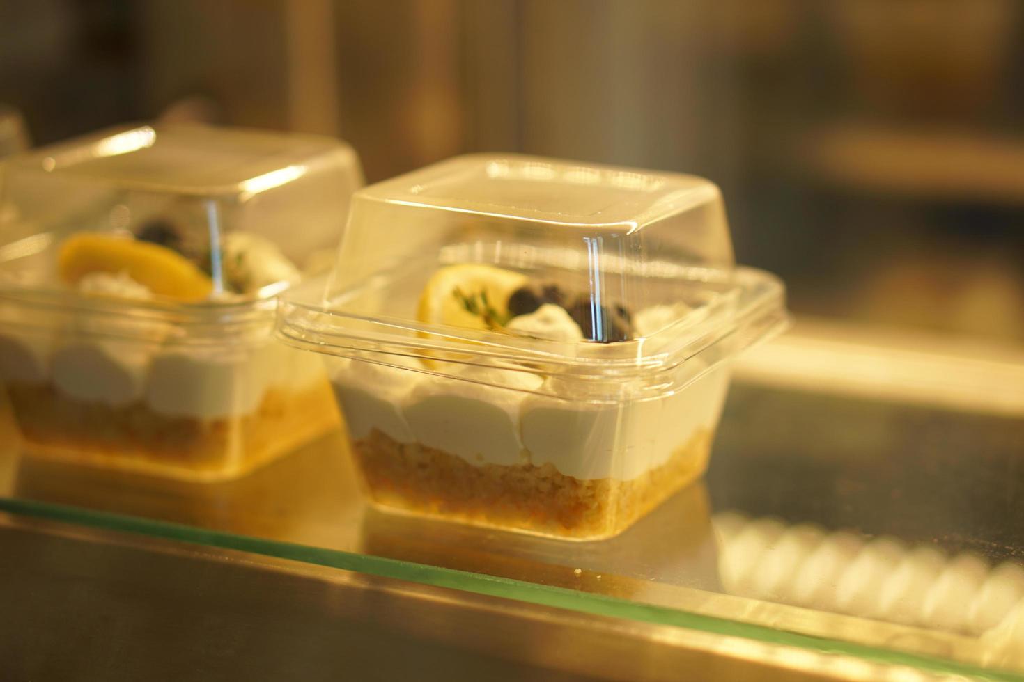 Cake in glass cabinet with orange lights photo