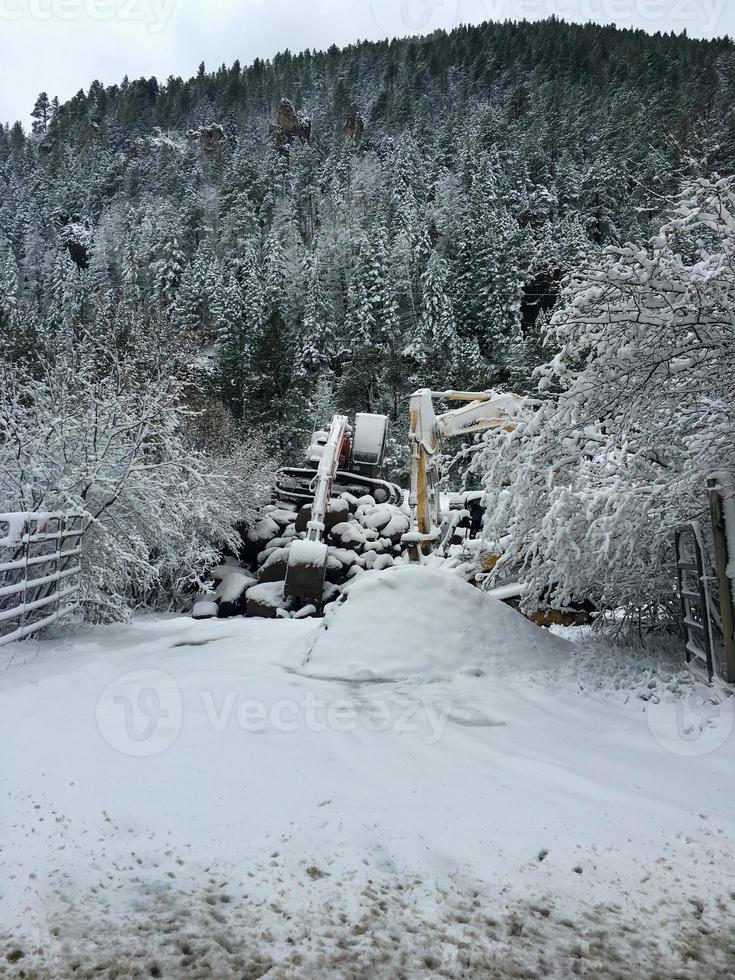 Heavy operating equipment covered in snow photo