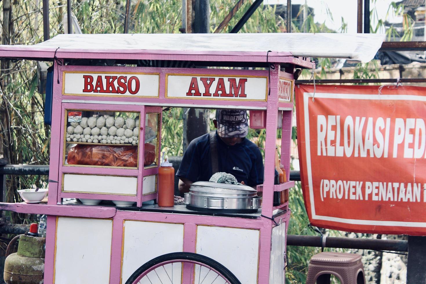 Badung, Bali - January 13 2023 Photo of a meatball cart with the seller making meatballs for his customers