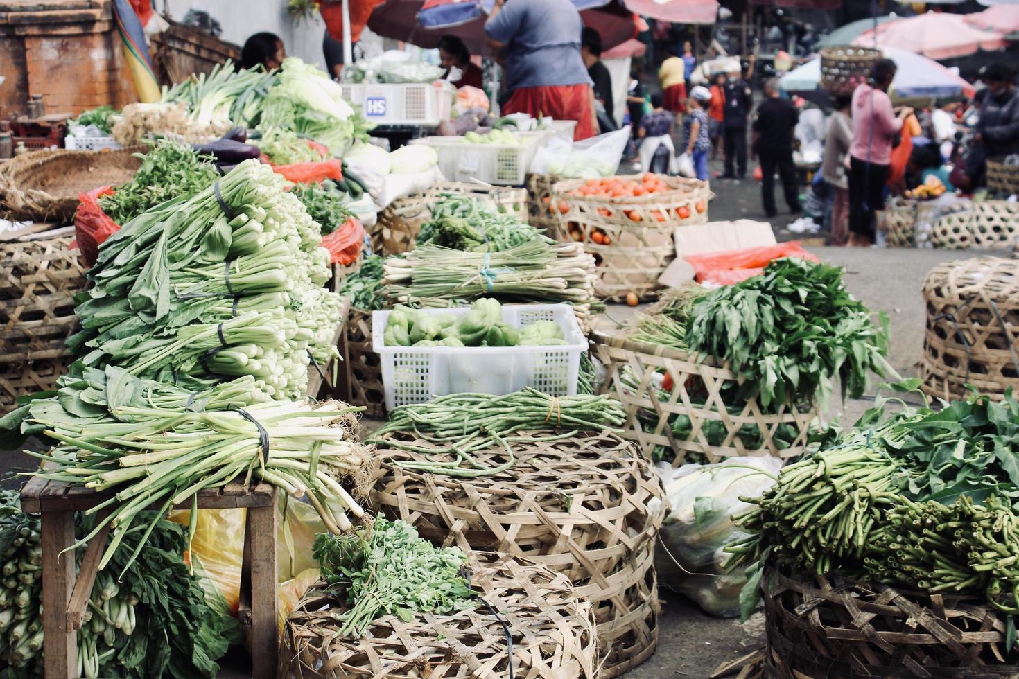 Badung, Bali - January 13 2023 Photo of various types of fresh green vegetables and fresh fruit in the Kumbasari Badung Traditional Market