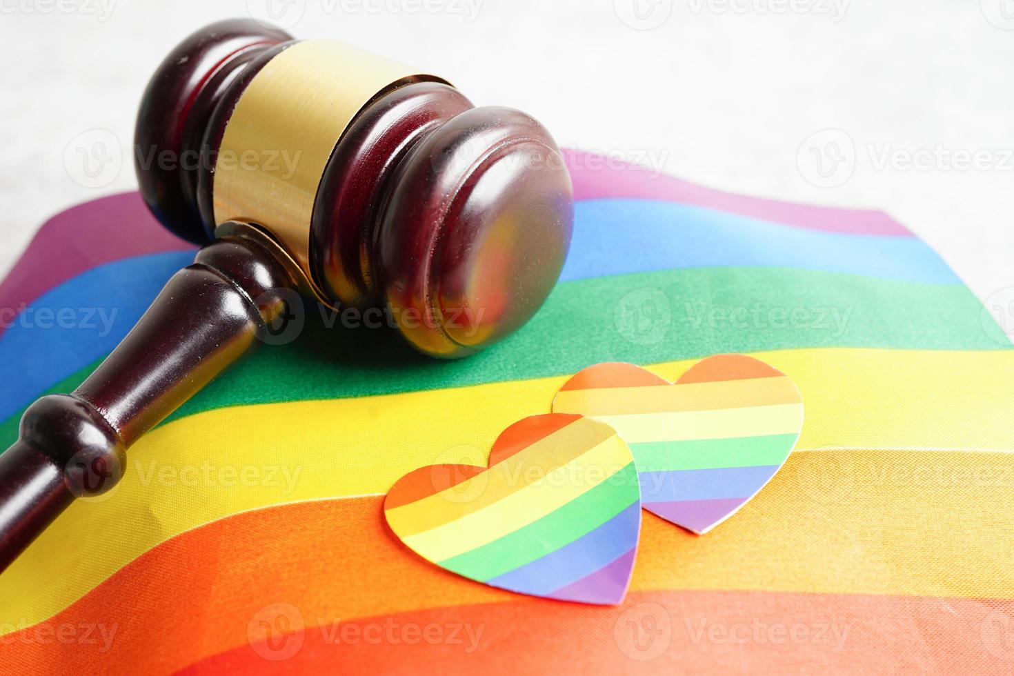 Gavel for judge lawyer with heart rainbow flag, symbol of LGBT pride month. photo