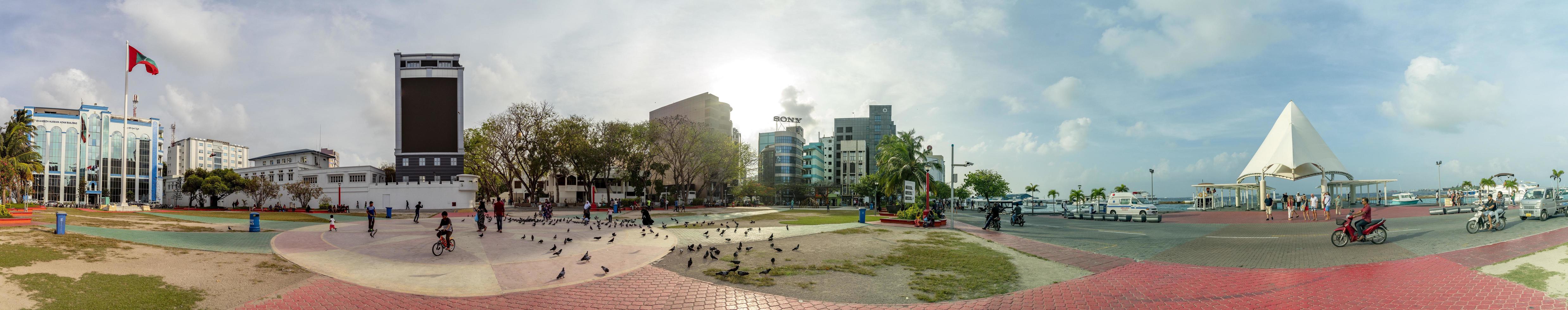 MALE, MALDIVES - FEBRUARY 16 2019 - People and children in island main place before evening pray time photo