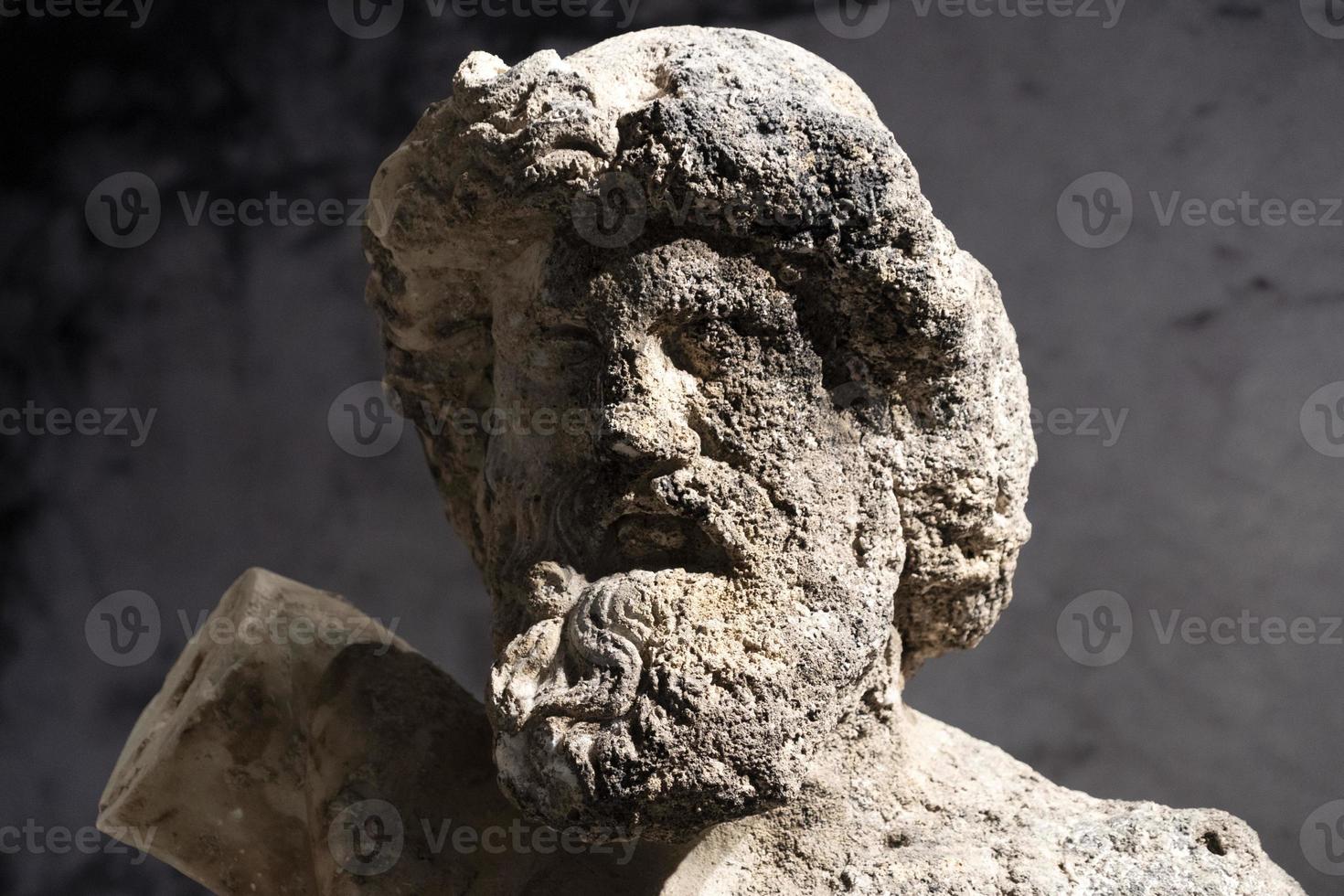 sea encrusted old roman marble statue photo