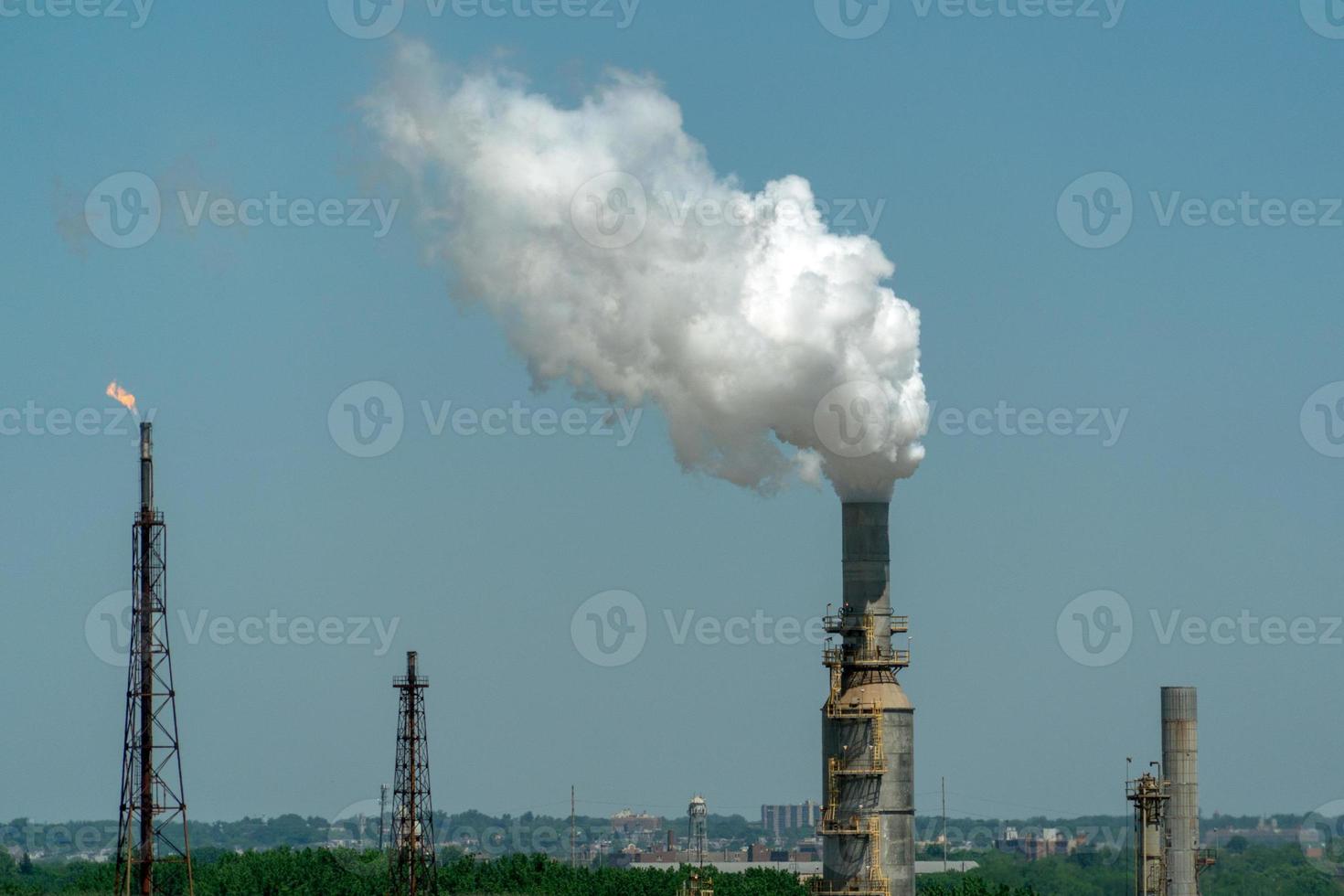 oil refinery smoking chimney detail photo