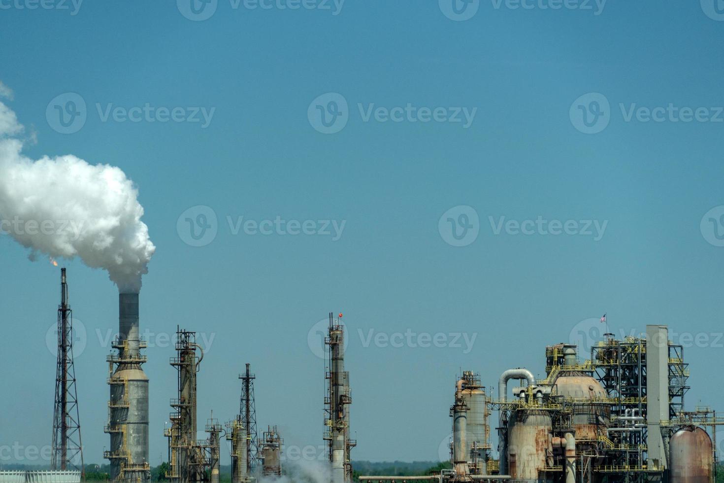 oil refinery smoking chimney detail photo