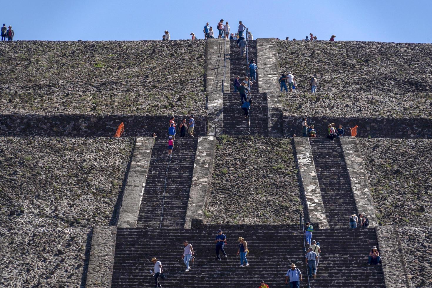 MEXICO CITY, MEXICO - JANUARY 30 2019 - Tourist climbing Teotihuacan pyramid mexico photo