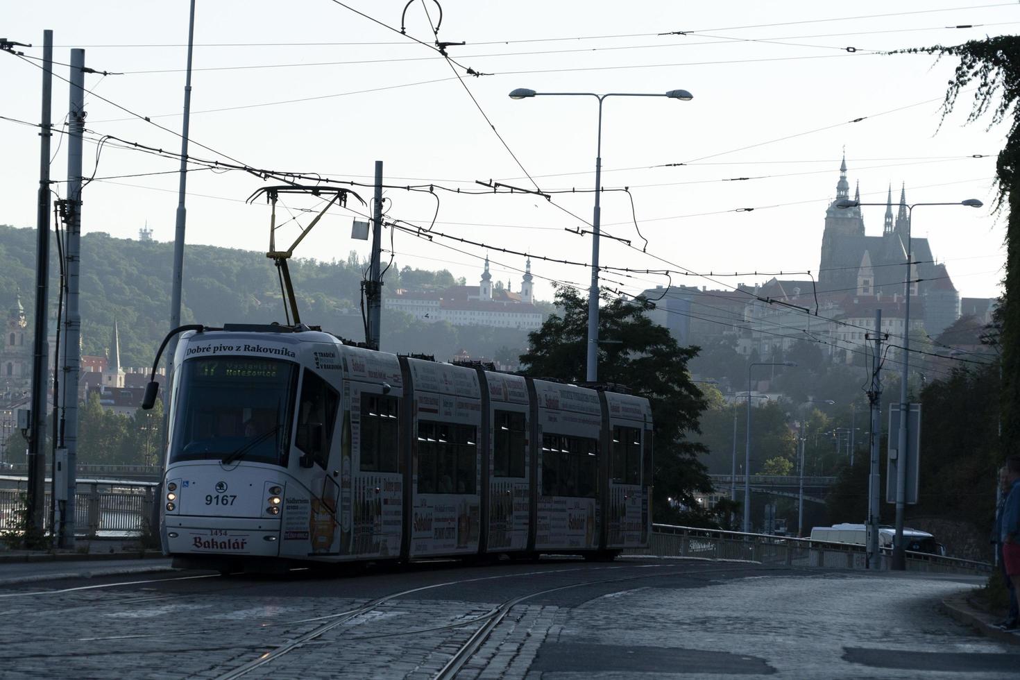 PRAGUE, CZECH REPUBLIC - JULY 15 2019 - Typical red tram of Town full of tourist in summer time photo