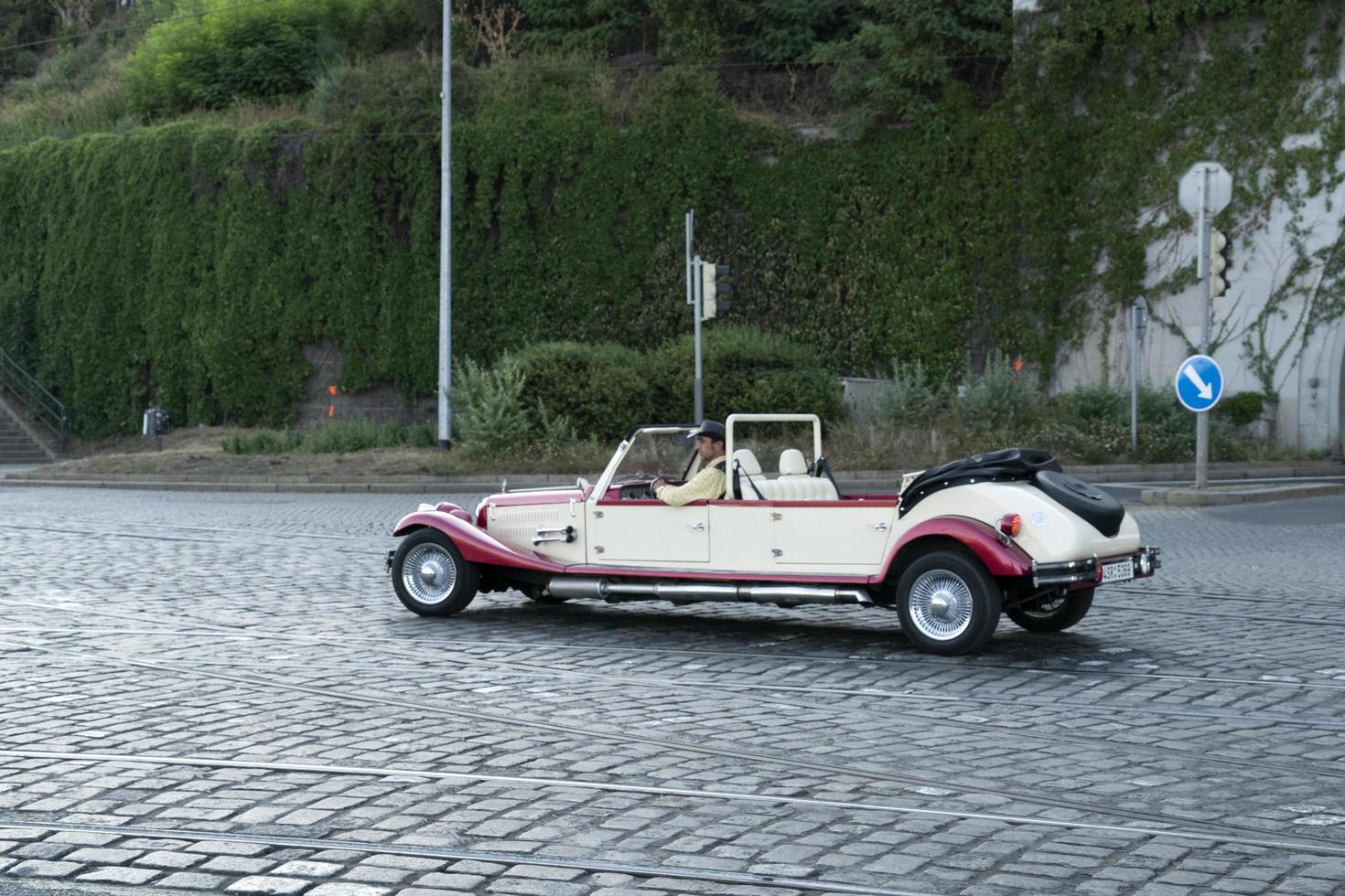 PRAGUE, CZECH REPUBLIC - JULY 15 2019 - Old style cars in Town is full of tourist in summer time photo