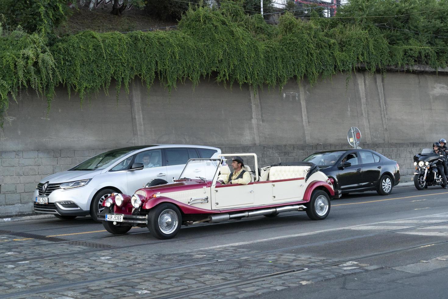 PRAGUE, CZECH REPUBLIC - JULY 15 2019 - Old style cars in Town is full of tourist in summer time photo