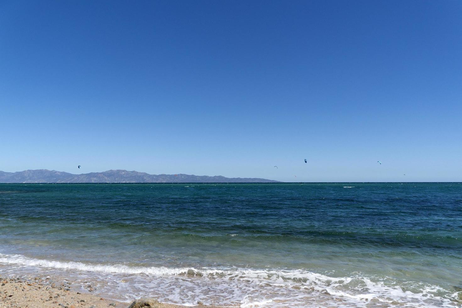 LA VENTANA, MEXICO - FEBRUARY 16 2020 - kite surfering on the windy beach photo