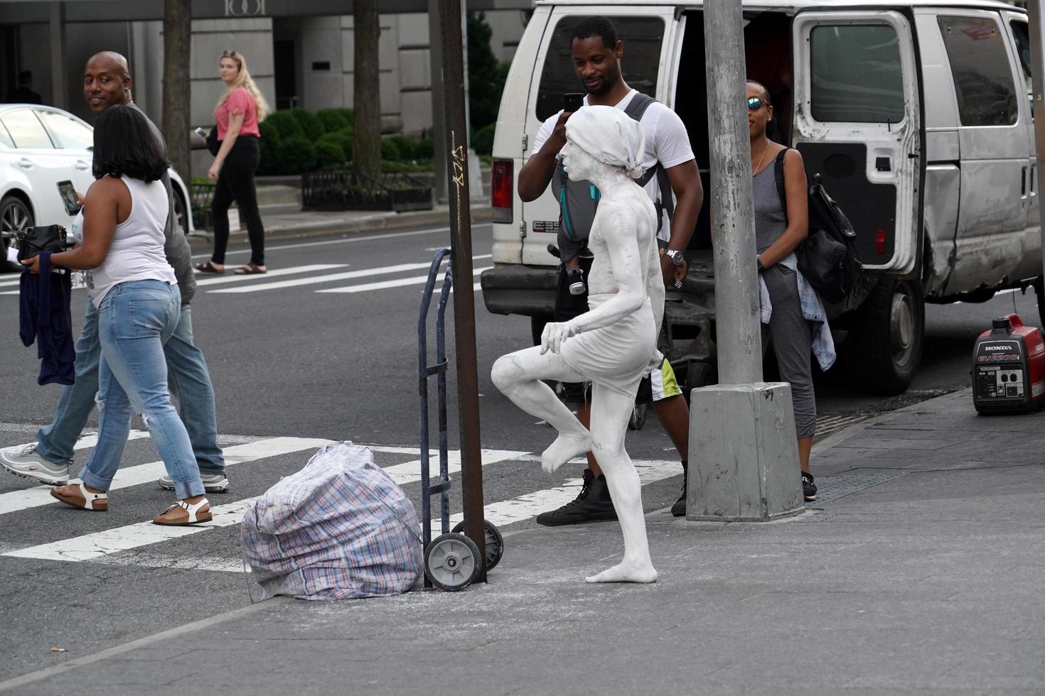 NEW YORK, USA - MAY 27 2018 - living statue performer outside Met photo