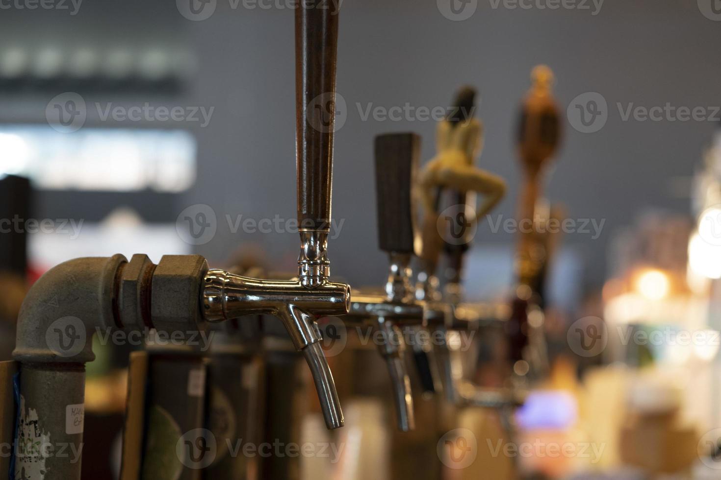 beer disenser many of at the pub bar photo