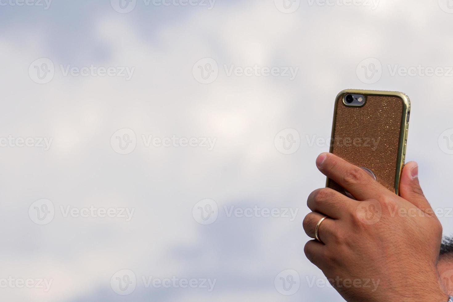 hand taking selfie picture with smartphone photo