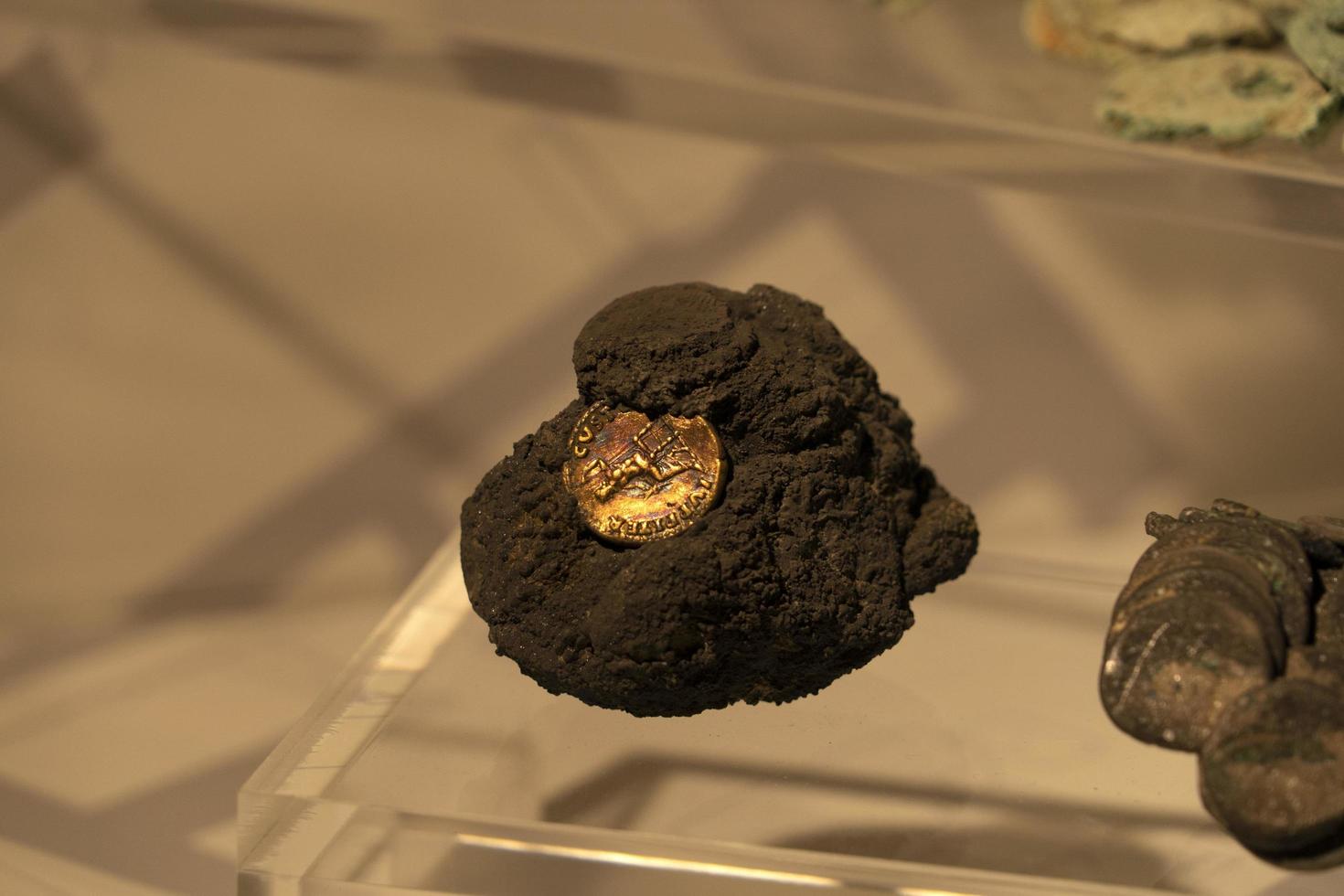 ERCOLANO, ITALY - FEBRUARY 2 2020 - Ercolano Herculaneum ancient ruins gold  exhibit photo