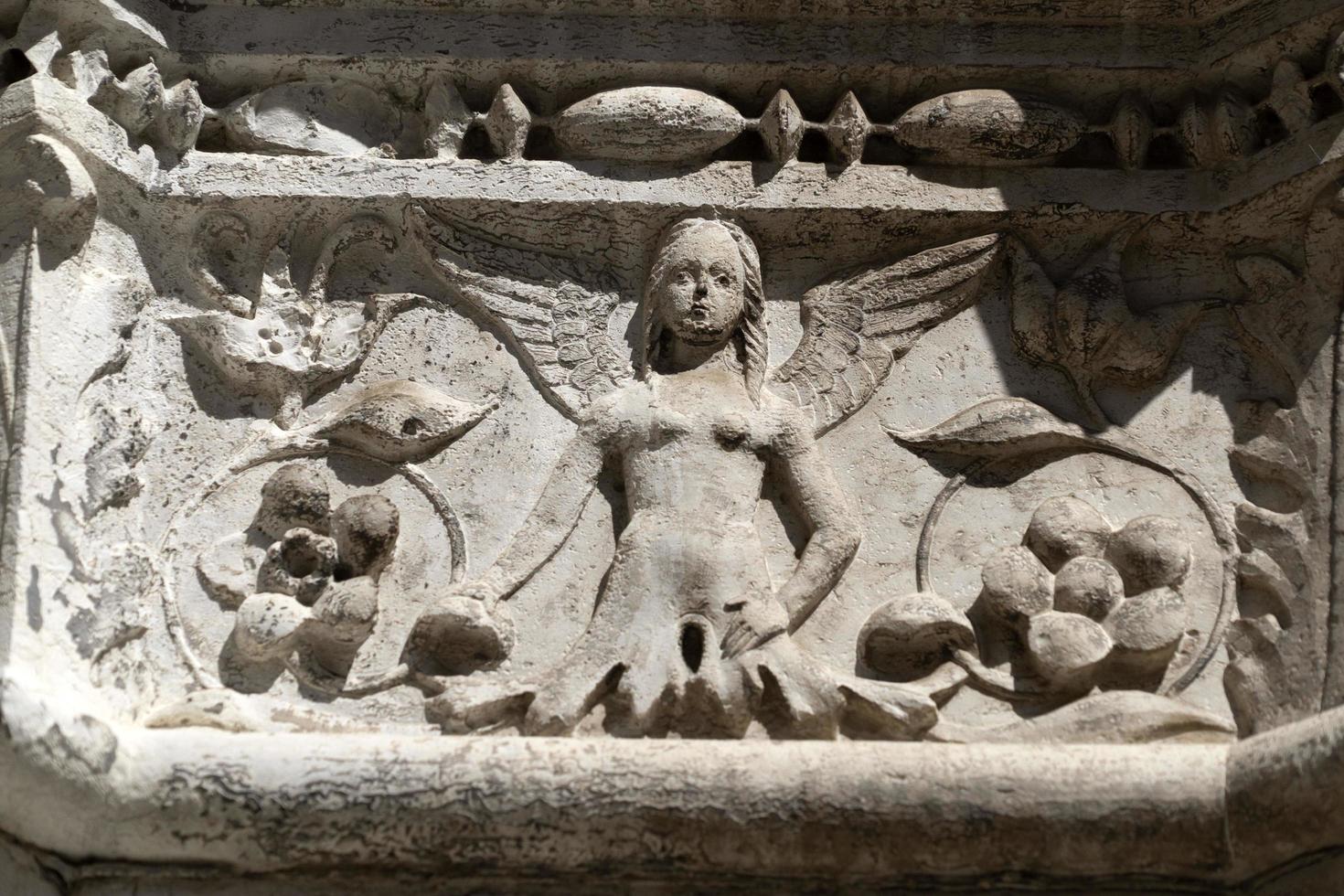 VENICE, ITALY - SEPTEMBER 15 2019 - doge ducal palace capital of column wayside sculpture detail photo