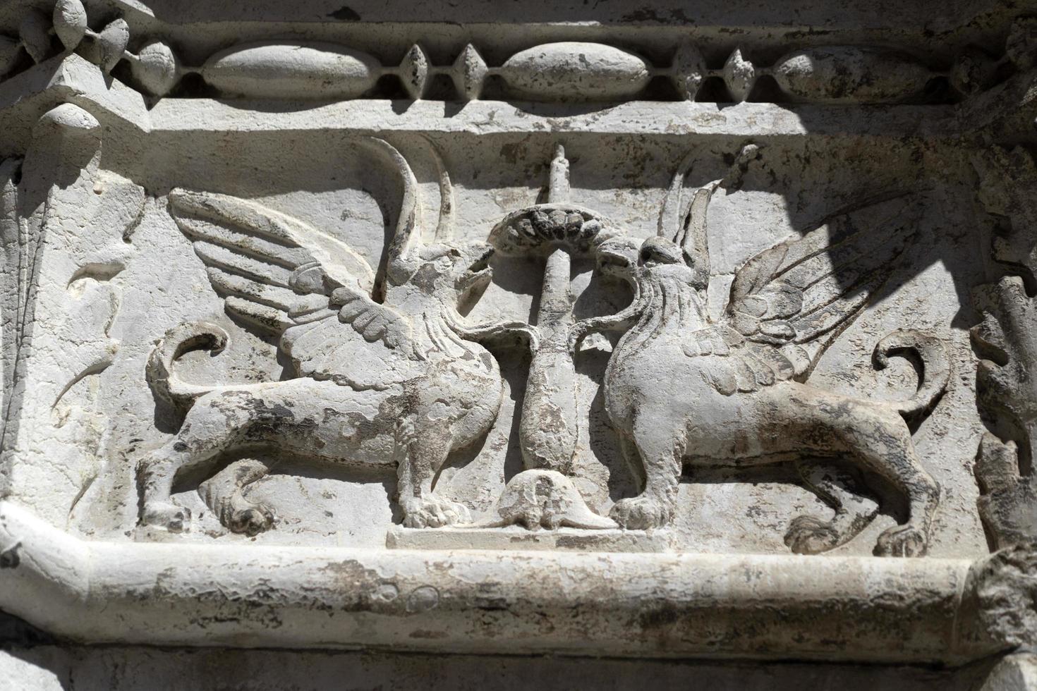 VENICE, ITALY - SEPTEMBER 15 2019 - doge ducal palace capital of column wayside sculpture detail photo