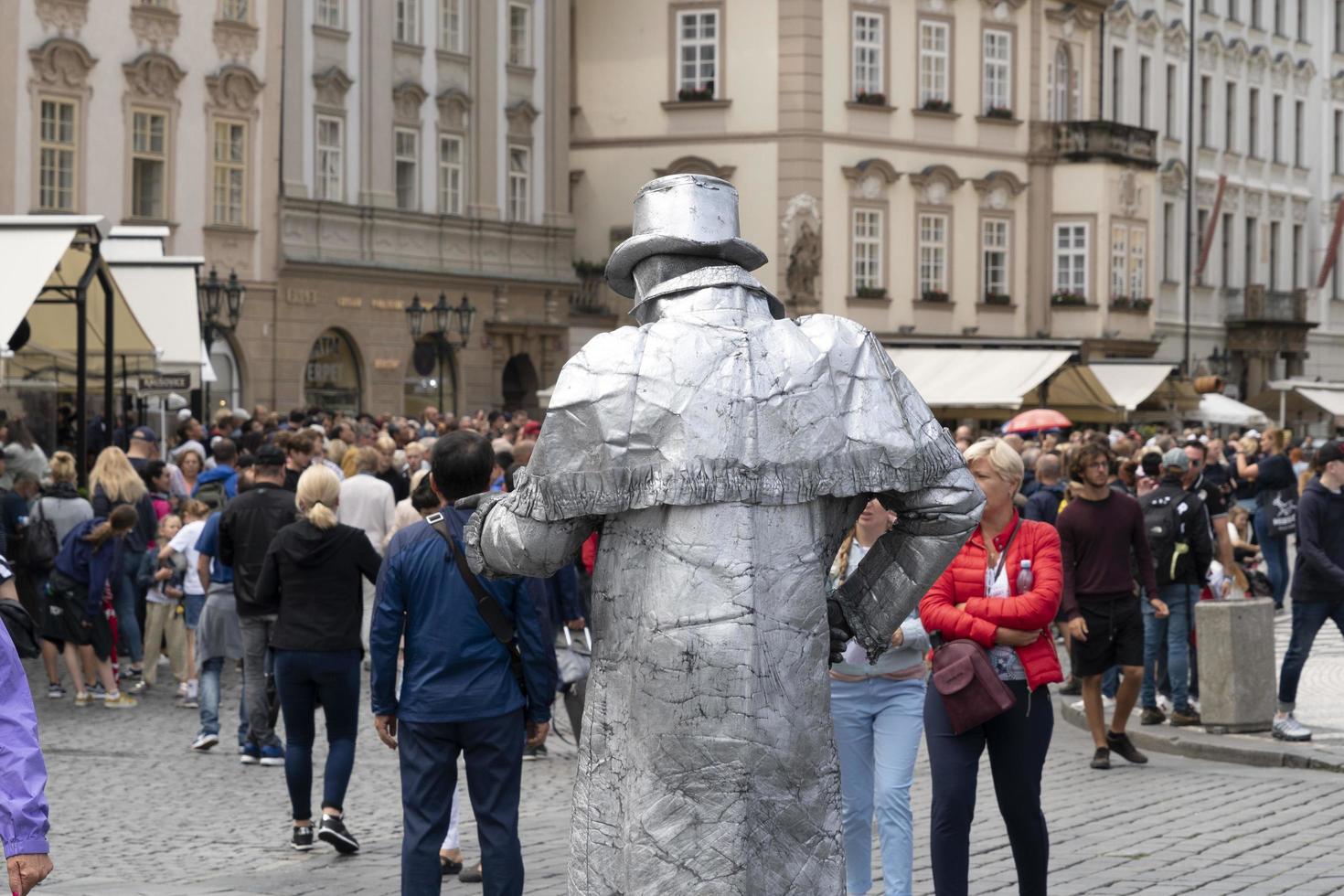 PRAGUE, CZECH REPUBLIC - JULY 16 2019 - Old town square full of tourist  street artist is acting as iron man dress 17410389 Stock Photo at Vecteezy