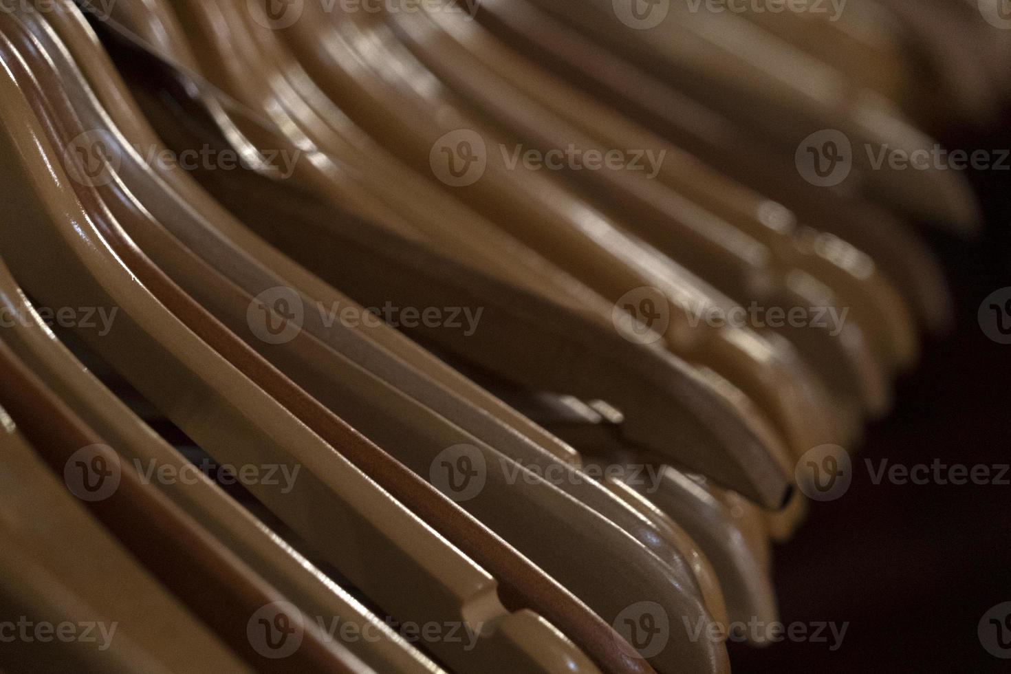 many wooden clothes hangers photo
